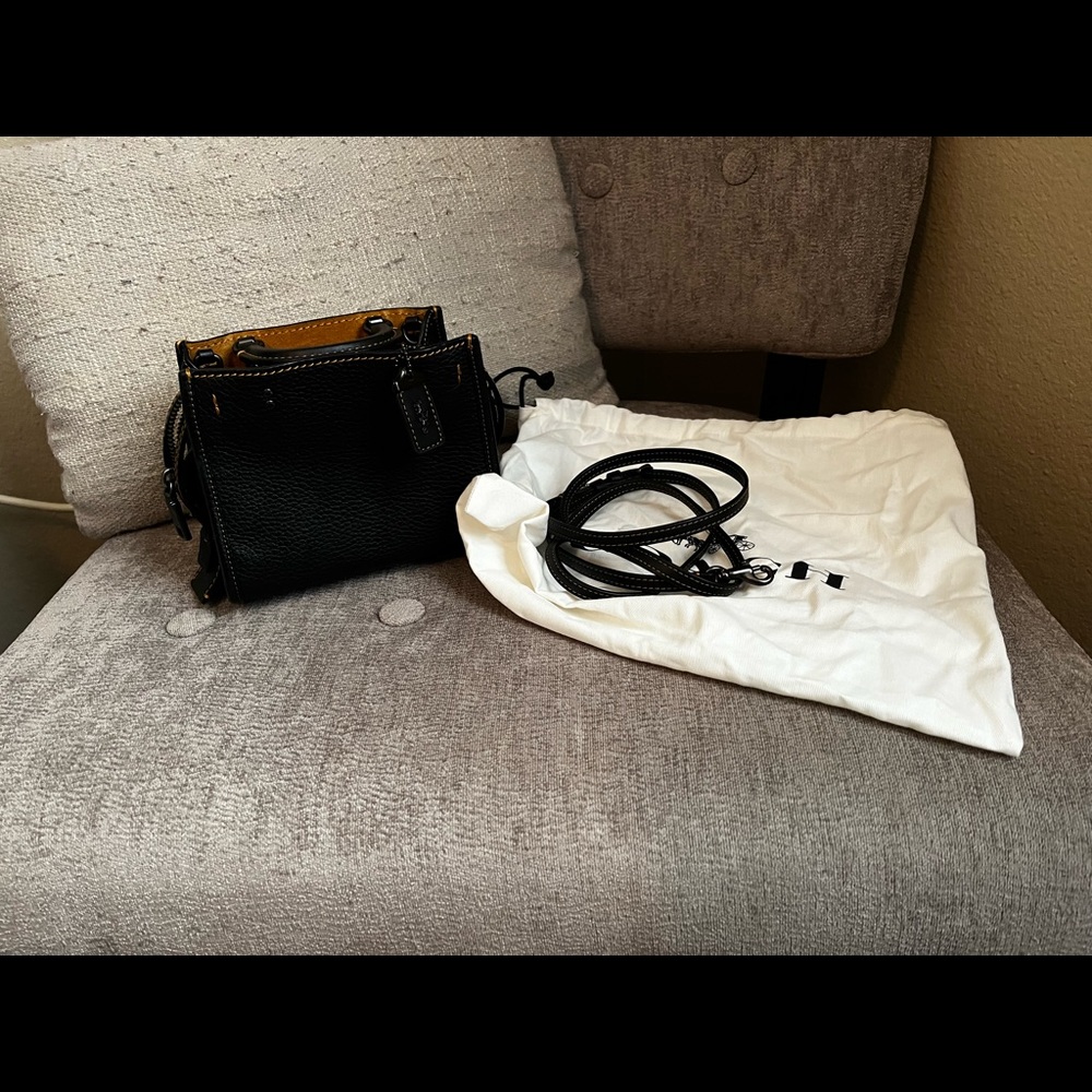 Coach black leather mini bag.